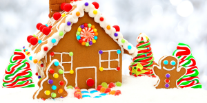 A gingerbread house decorated with candy and icing.