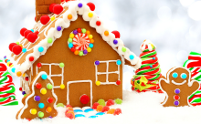 A gingerbread house decorated with icing and candies.